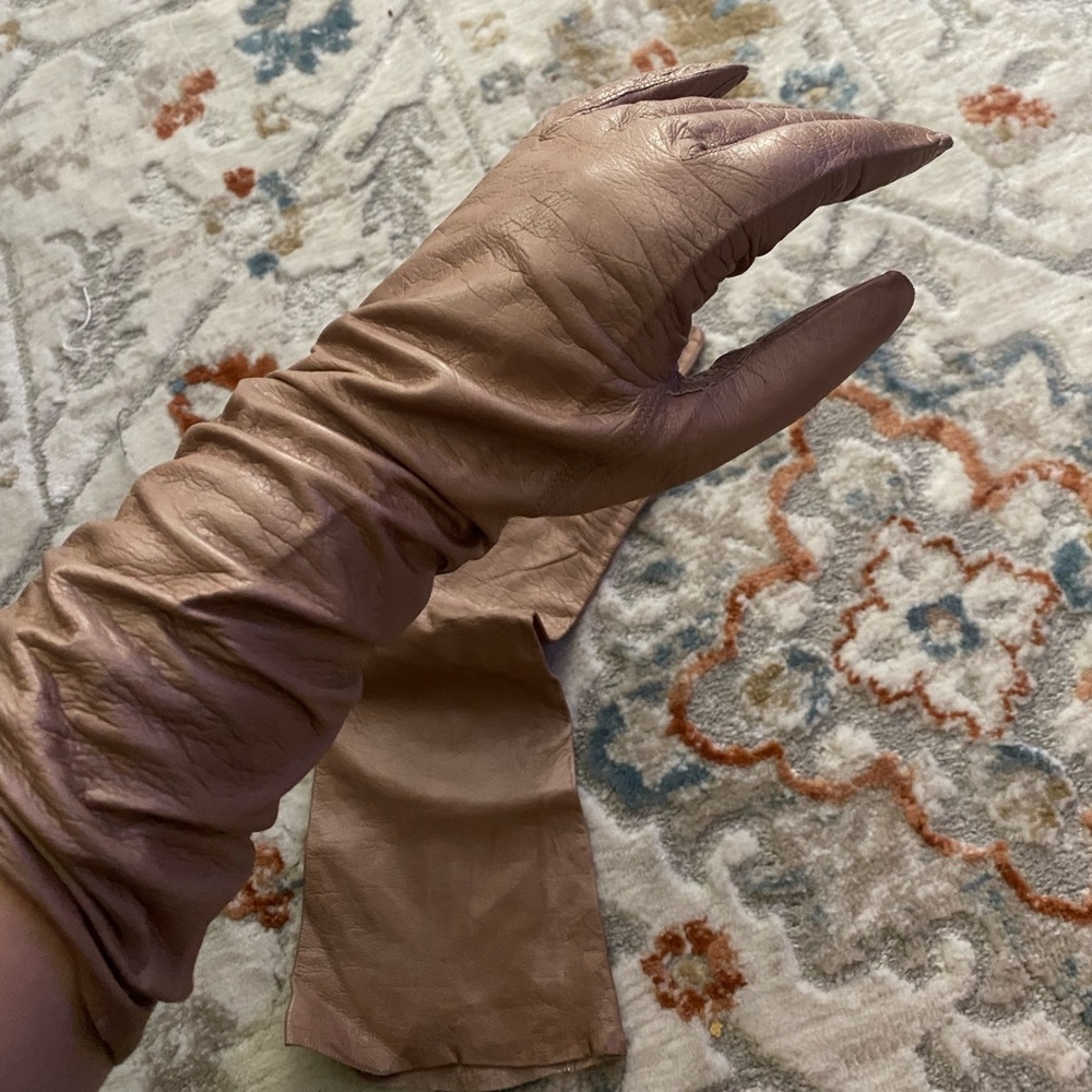 Brown leather gloves.
